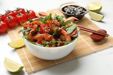 Delicious shrimp salad in bowl served on white table