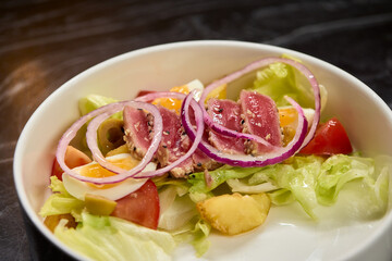 A Fresh and Colorful Salad with a Variety of Fresh Vegetables and Sliced Onions Included