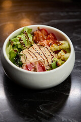A Fresh and Colorful Salad Bowl that features Grilled Chicken and a Variety of Vegetables