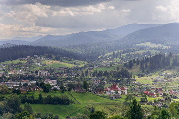 Scenic landscape view of Vorokhta, picturesque mountain village with green hills and forests