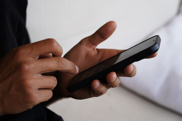 Close-Up of a Hand Holding a Smartphone