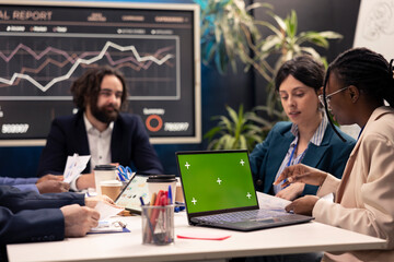 Project team developing strategies with mockup screen on laptop, sharing details and project goals, expressing concerns. Firm employees collaborating on organizational growth.