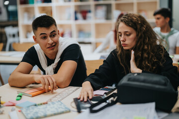 Two students are engaged in a classroom setting, discussing and working together. The scene conveys collaboration, learning, and focus in an educational environment with books and stationery on the