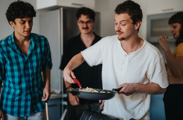 A group of young friends enjoy cooking together in a modern kitchen, sharing a meal and bonding...