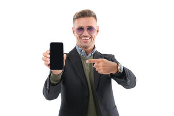 Mature business man presenting phone screen. Businessman man showing phone isolated on white....