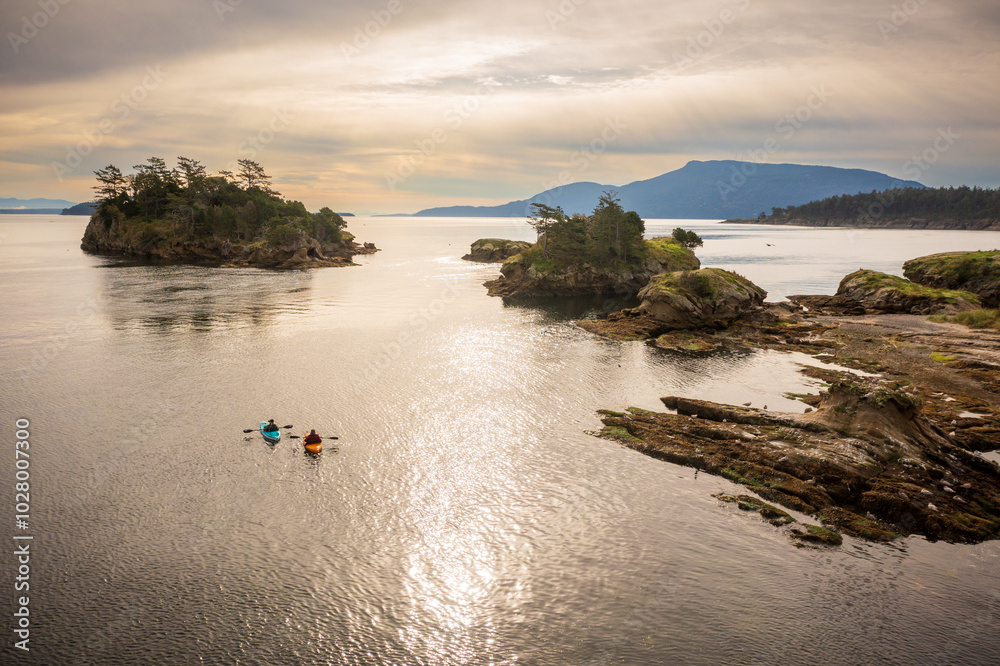 Wall mural Aerial View of Kayakers in Ewing Cove, Sucia Island, Washington. Emerald waters and sandstone formations make Sucia Island a must go destination for kayakers worldwide. Located in the Salish Sea area.