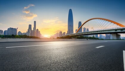 Obraz premium asphalt road square and bridge with modern city buildings scenery at sunset in guangzhou car advertising background