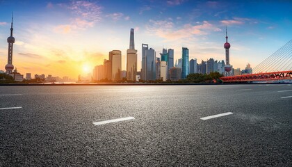 Obraz premium asphalt road square and bridge with city skyline at sunset in shanghai