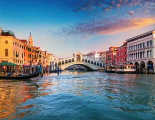Naklejka premium picturesque morning cityscape of venice with famous canal grande and colorful view of rialto bridge