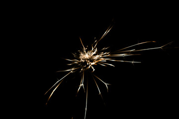 sparks from the grinder glowing in the dark