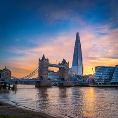 Naklejka premium tower bridge and the shard at sunset taken from wapping london