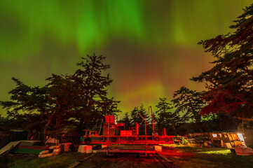Northern Lights along Legoe Bay Road on Lummi Island in Washington state. Old abandoned fishing...