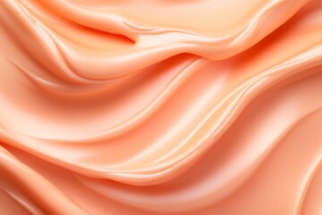 Smooth peach-colored cream with a glossy finish for cosmetic product advertising in a top-down view showcasing its texture