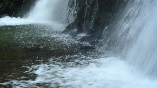 Closeup of water falling into the pond of a waterfall in autumn, Josefsthaler Wasserf&auml;lle