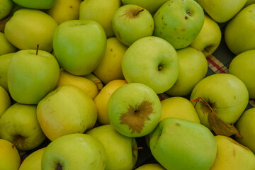 Delicious green apples on retail display at supermarket