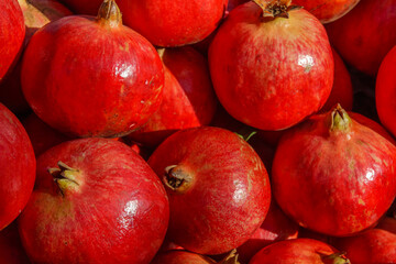 Heap of ripe pomegranates. Homegrown produce in Turkey