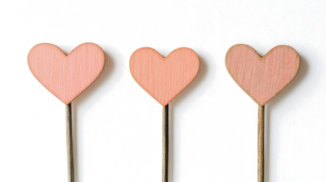 Wooden Heart Symbols on Sticks Against a White Background Generative AI - Powered by Adobe