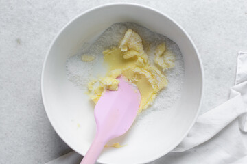 Top view of Creaming butter and sugar with a spatula, the process of making a cake or cookie