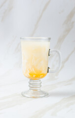 Es Kelapa Jeruk, a typical Indonesian drink made from fresh oranges squeezed with grated young coconut. with copy space. perfect for recipe, article, catalogue, or any commercial purposes.
