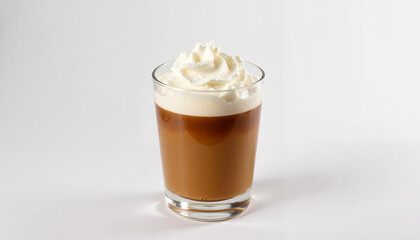 Rich Irish coffee topped with whipped cream in a clear glass on a white background