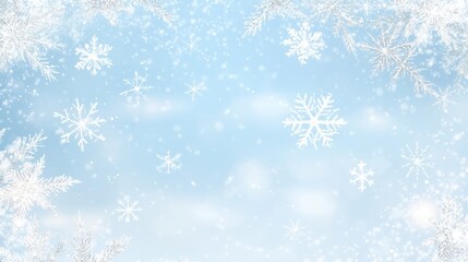 Elegant snowflakes gently falling against a soft blue sky.