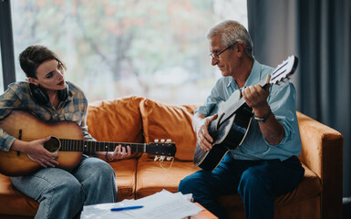 An elderly professor guides a student on playing the guitar during a music class at school. The setting is relaxed and focused, emphasizing education and mentorship in a cozy environment.