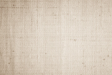 Closeup detail of beige fabric texture background. High resolution photo.