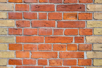 Fototapeta premium Block wall backdrop, wall art design. Wall with brick texture for banner. Elevation tiles of brickwall. Texture of stone wall. Brickwork background for design.