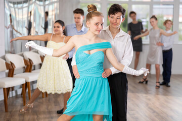Couple boy and girl dancing couples ballroom dance in studio