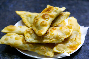 Traditional rustic Brazilian pastry, fried and stuffed with ground beef