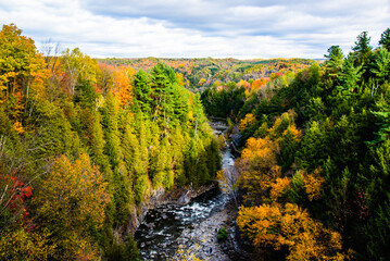 Coaticook, Canada - Oct. 12 2024: Colorful autumn season in Parc de la Gorge