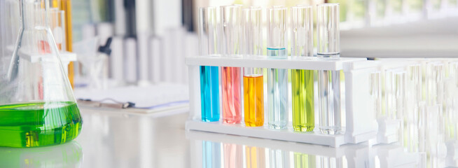 Banner Science laboratory chemistry test science lab with microscope glass tubes chemical beaker scientific background. Colorful Liquid biology laboratory fluid scientist experiment with copy space