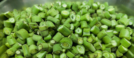 Chopped broad bean pods ready to cook