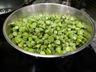 Chopped broad bean pods ready to cook