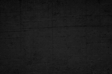 Black dark concrete wall background. Grunge textured black paper background with rough surface for vintage design.