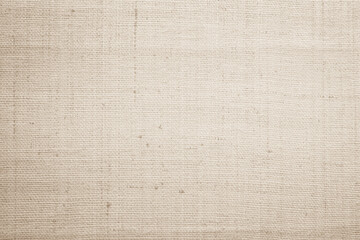 Closeup detail of beige fabric texture background. High resolution photo.