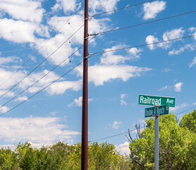 Street signs next to a telephone pole in Ash Fork, Arizona, USA on a sunny summer day