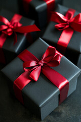 Obraz premium black gift boxes elegantly tied with a red ribbon