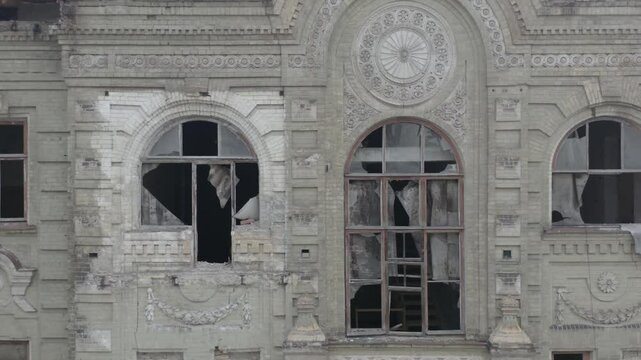 Aerial Side View of Abandoned 19th Century Neoclassical Mansion. Urban Brick Facade with Renaissance and Baroque Elements - Symmetrical Architecture with Ornate Pediment. Shot in log profile 