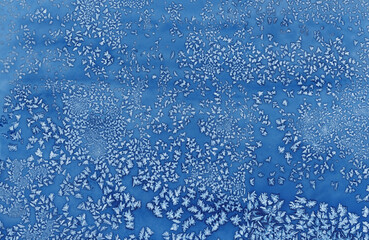 Abstract blue frost pattern resembling ice crystals, perfect for winter-themed designs, backgrounds, and creative projects.