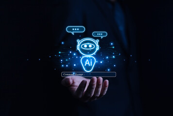 Businessman chatting with AI or artificial intelligence technology. A man uses a laptop computer to...
