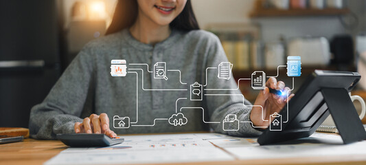 woman interacts with digital tablet while working on project, showcasing blend of technology and productivity. scene reflects modern work dynamics and digital engagement