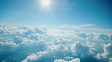 Fototapeta premium Beautiful Fluffy Clouds and Blue Sky from Airplane Window