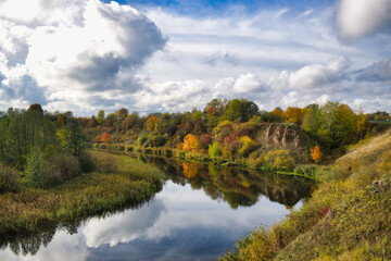 Calm and reflective water mirroring surroundings