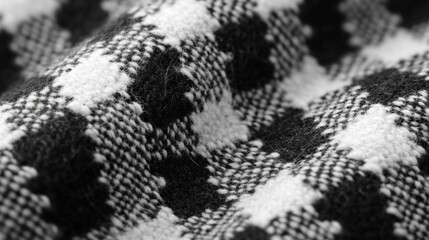 Obraz premium Close-up of Black and White Woven Fabric with a Textured Surface