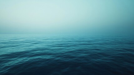 Calm Ocean Surface with Misty Sky