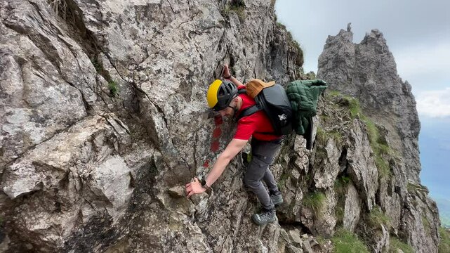 Male Hiker On Rocky And Steepy Slopes Of Grignetta Mountain In Italy - Tracking Shot