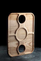 The sideboard is made of wood for serving snacks, fruits, nuts, cheeses, meats and original serving of main dishes. Luxury products from hard and exotic wood species. Accessories for a modern kitchen.