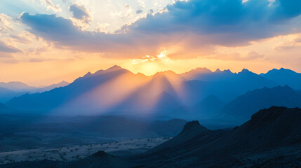 A sunrise illuminating the desert mountains, creating a magical atmosphere.
