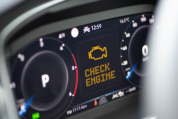 Interior of a modern car and a Check Engine warning light